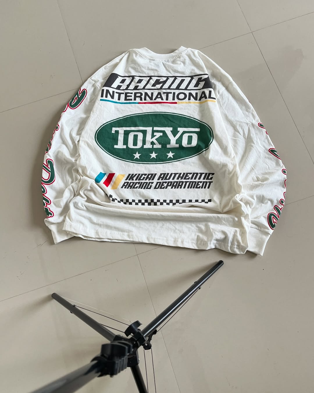 Bakc view of White full sleeves racing graphic tee with Tokyo, Ikigai, and international racing prints – Junk Fits