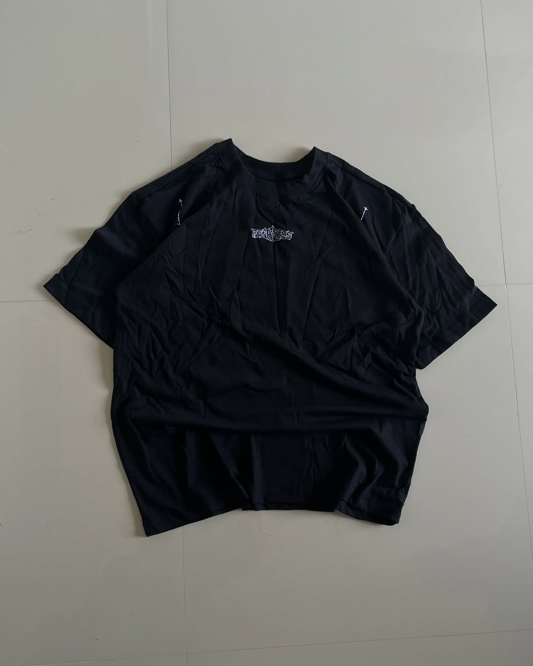 Back view featuring heatmap handprint and graffiti text design