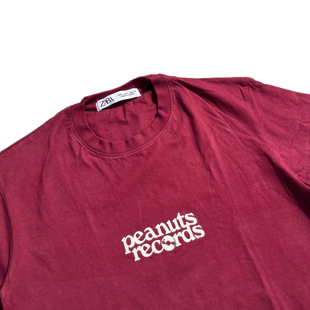 Close-up of Snoopy graphic print on ZARA Peanuts Tee