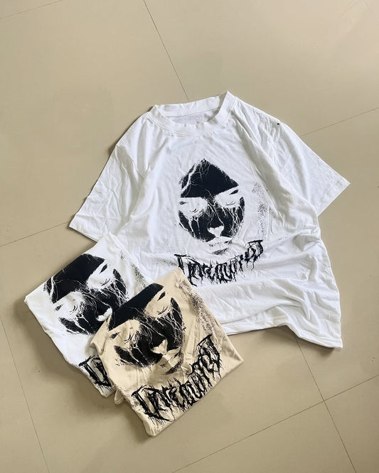 Oversized graphic tee with abstract dark face print and gothic lettering


