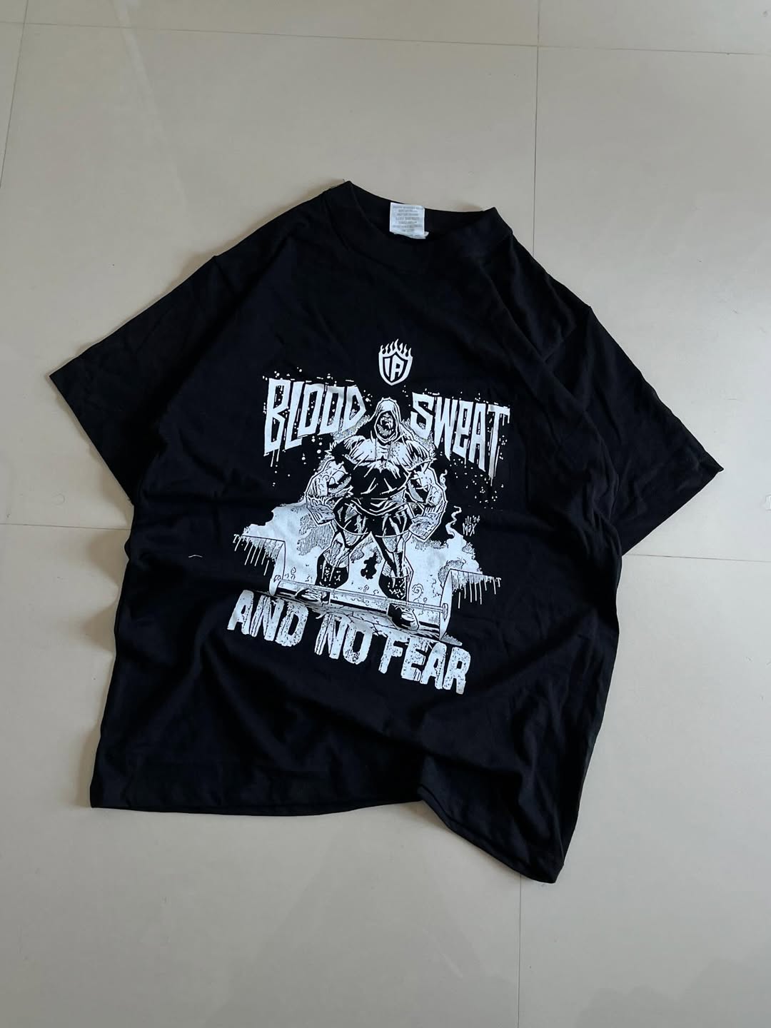 JUNKFITS Blood Sweat and No Fear black T-shirt with hooded figure illustration and bold distressed text

