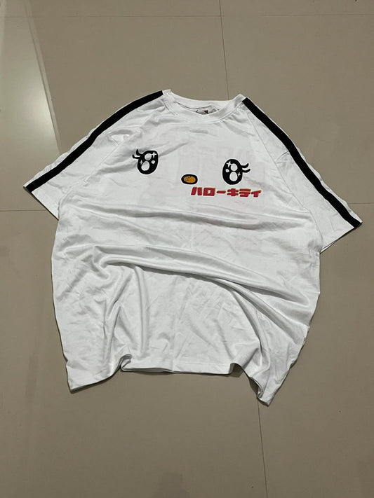 White oversized tee with cartoon eyes, Japanese text, and black sleeve stripes
