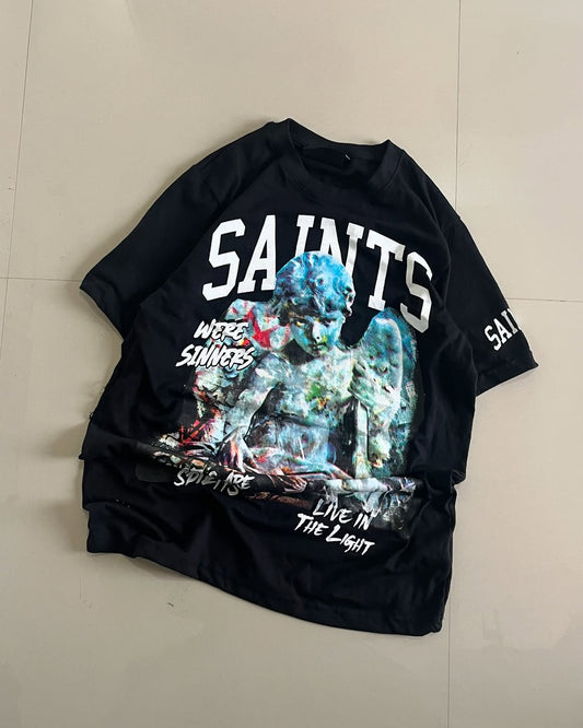 Black oversized t-shirt with colorful angel sculpture print and “SAINTS” text – streetwear by Junk Fits

