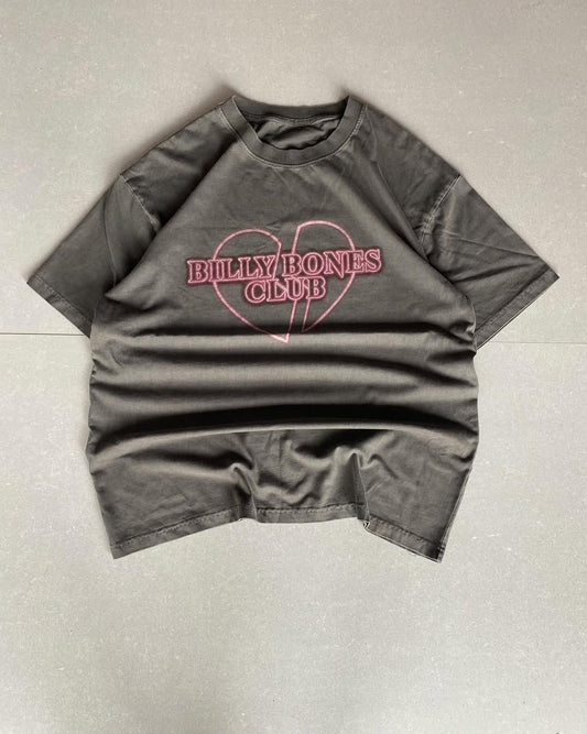 Junk Fits Billy Bones Club T-Shirt with pink broken heart print on washed black fabric

