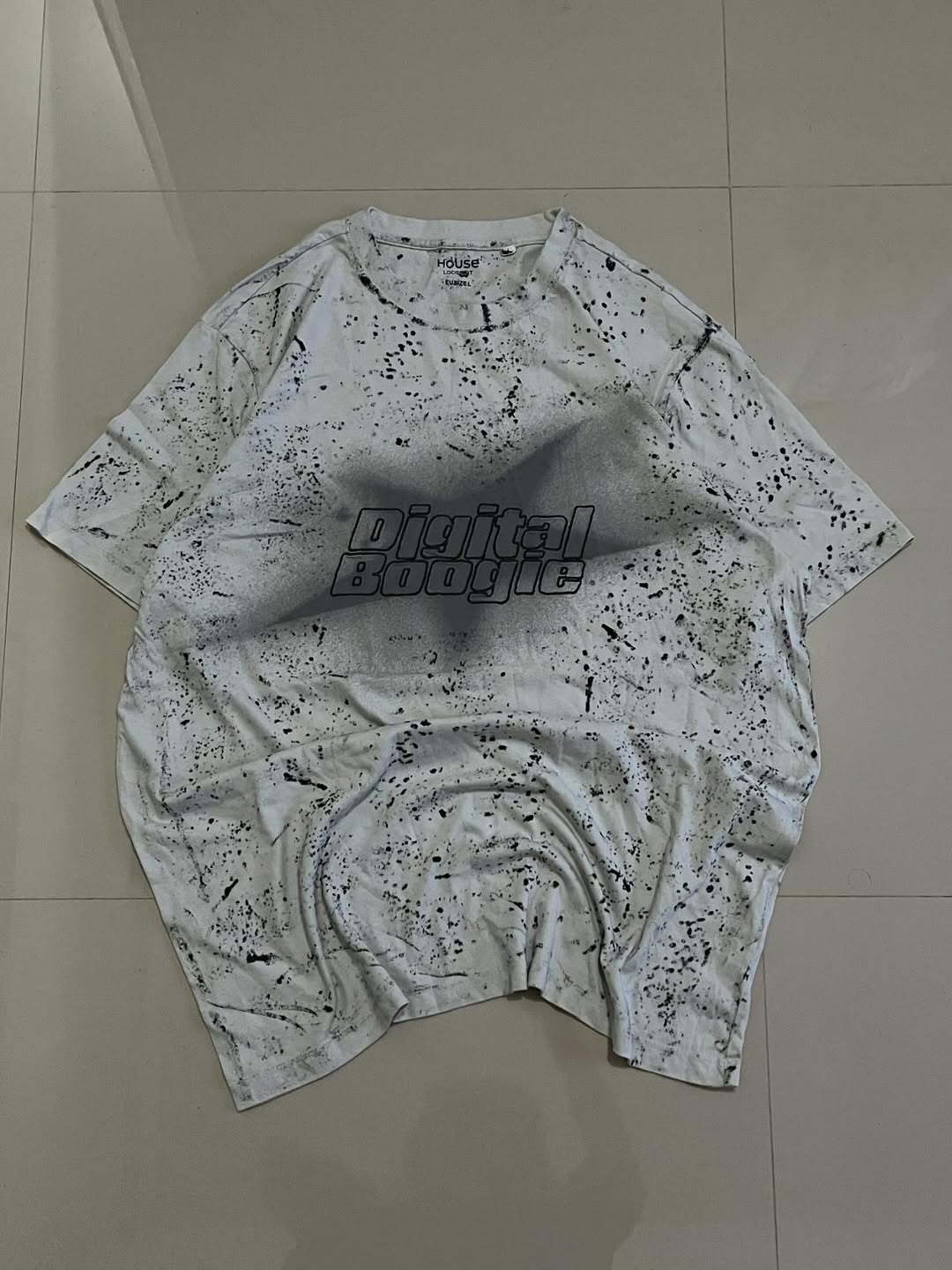 JUNKFITS Digital Boogie oversized white T-shirt with black paint splatter and bold chest logo

