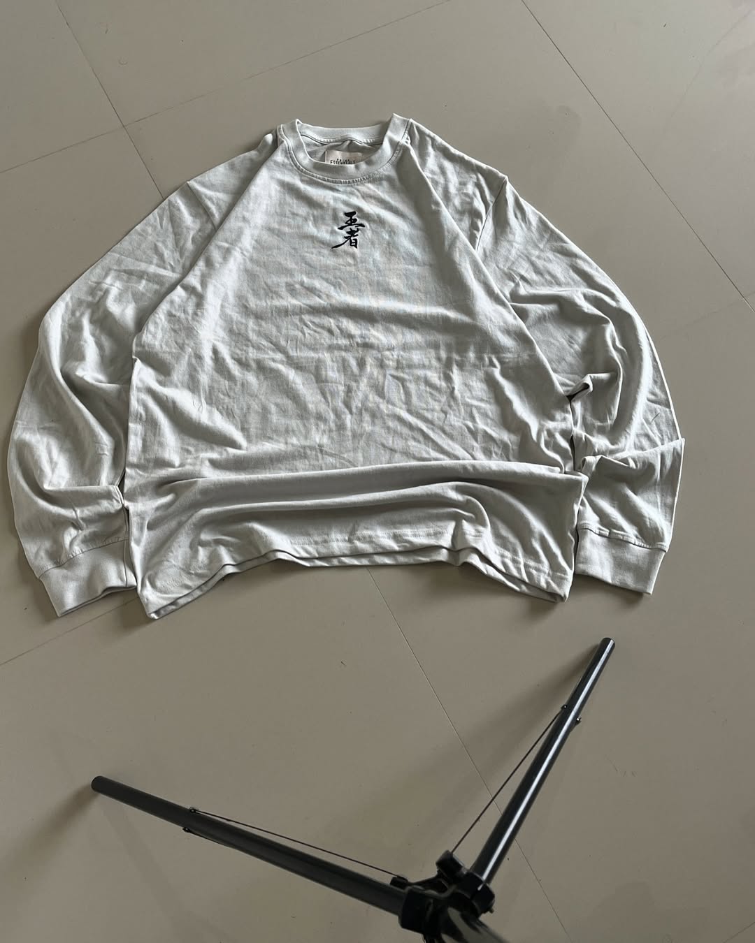 JunkFits Dragon Sun Long Sleeve T-Shirt Front View - Clean white shirt with minimal design