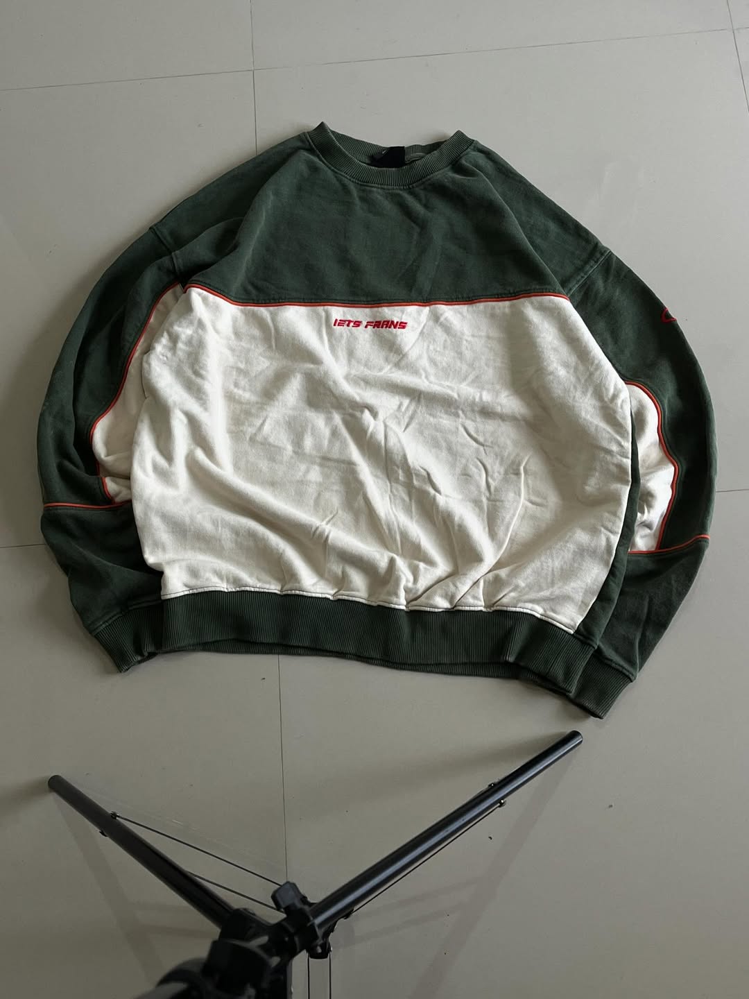 JUNKFITS oversized green and cream colorblock sweatshirt front view with red piping and chest print.