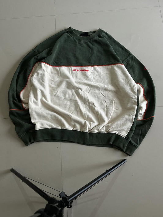 JUNKFITS oversized green and cream colorblock sweatshirt front view with red piping and chest print.