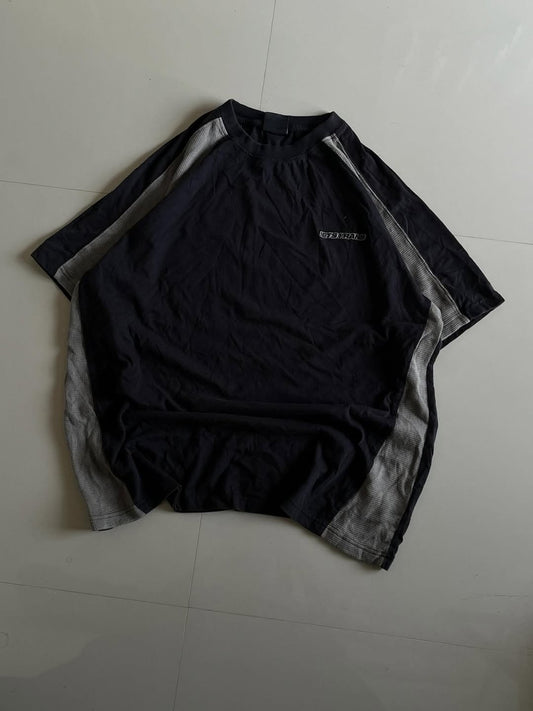 JUNKFITS oversized black tee with grey mesh panel inserts on sides and sleeves, front view.