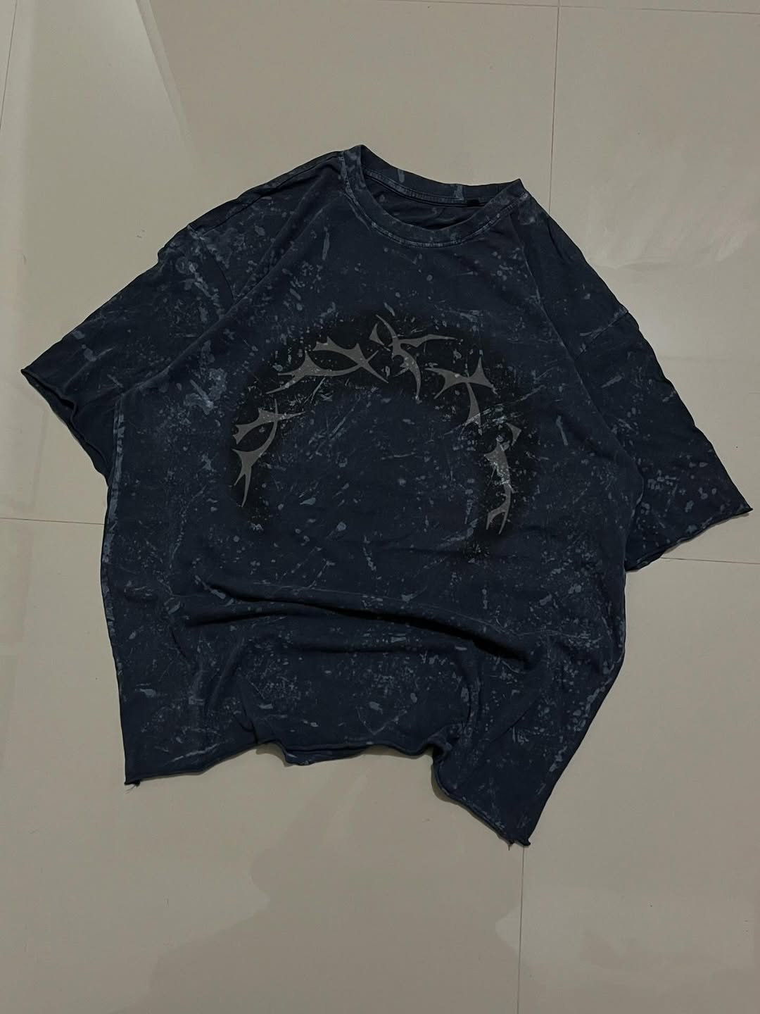 JUNKFITS oversized T-shirt in black with pink bleach effect and tribal circle graphic

