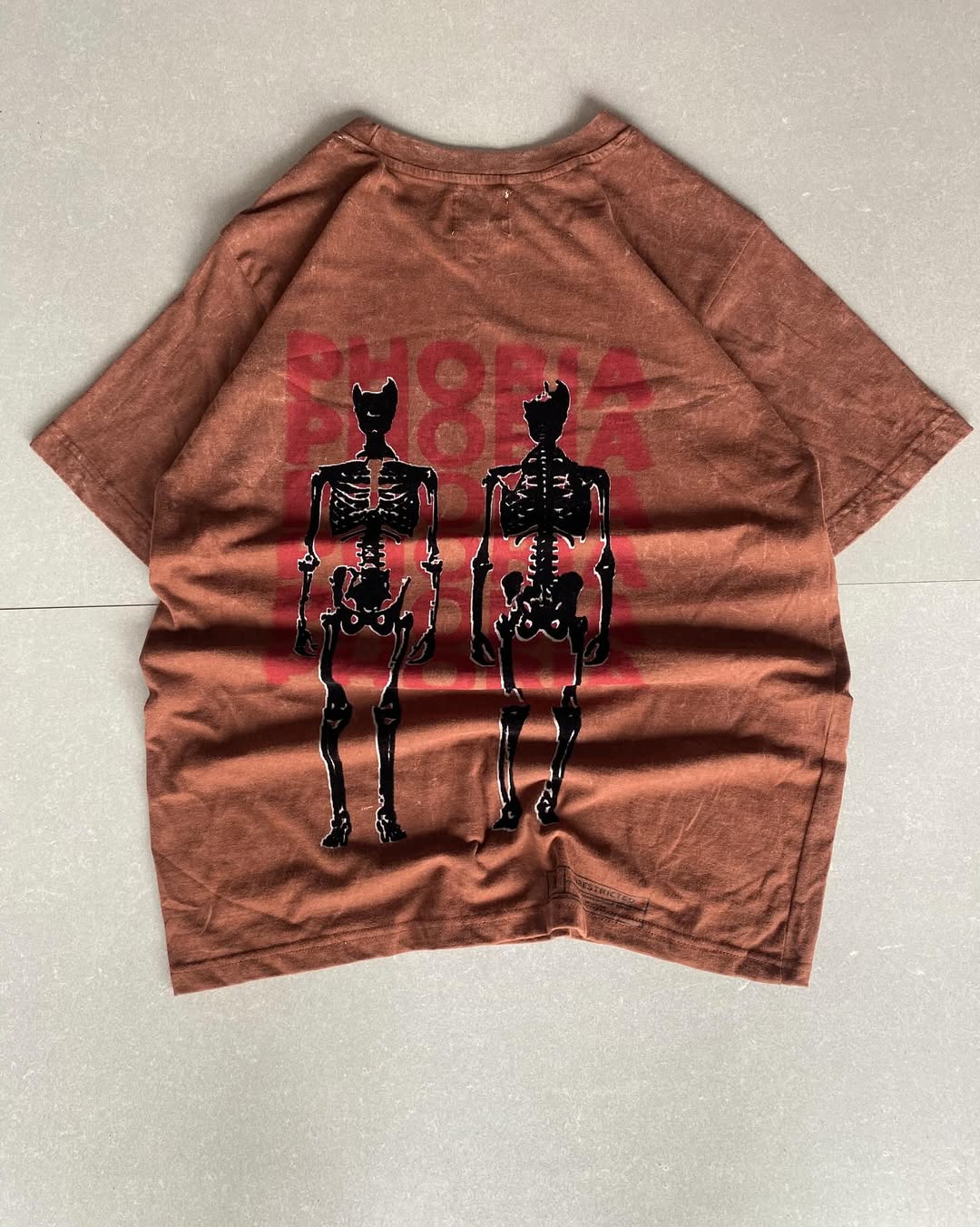 Front view of JunkFits rust red distressed t-shirt with plain front design