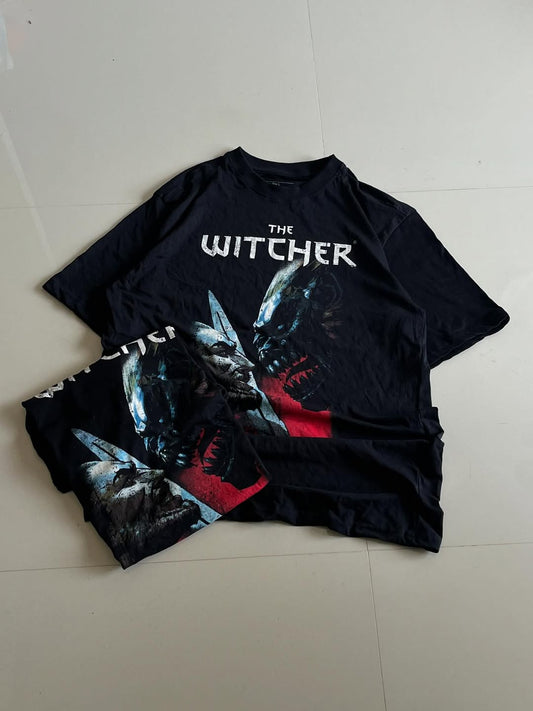Black JUNKFITS t-shirt featuring The Witcher Wild Hunt artwork with monster designs and logo

