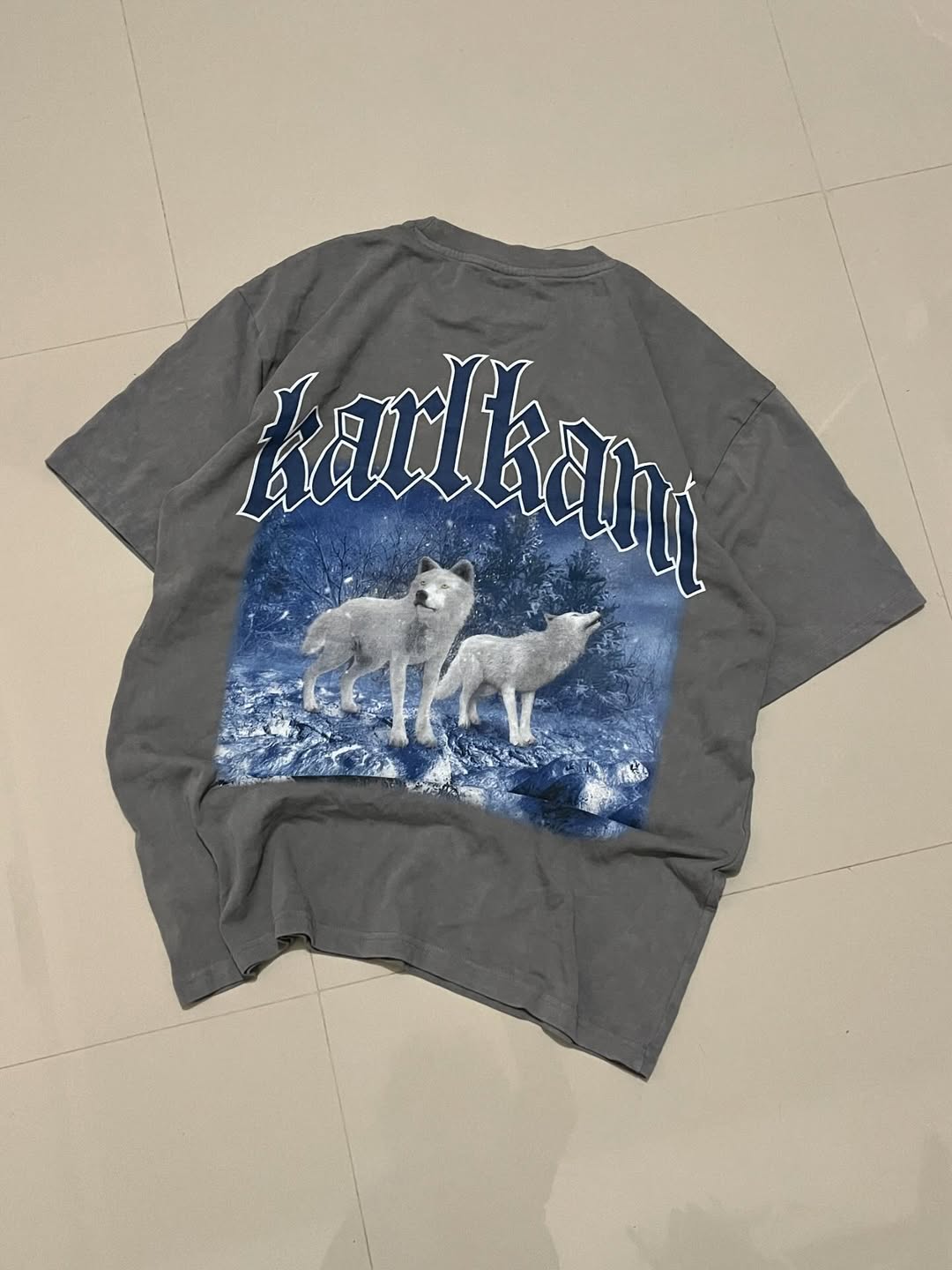 Back view of Karl Kani vintage grey T-shirt featuring bold wolf graphic and large gothic logo print

