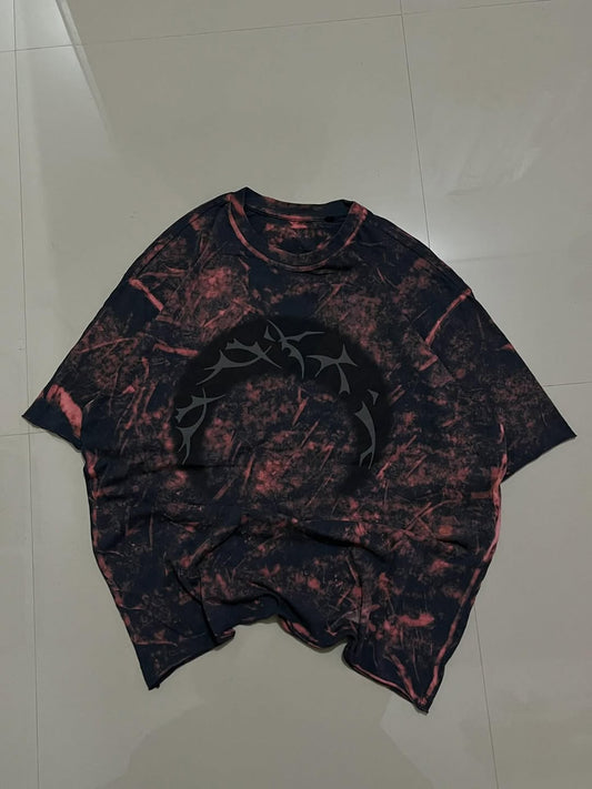 JUNKFITS oversized T-shirt in black with pink bleach effect and tribal circle graphic

